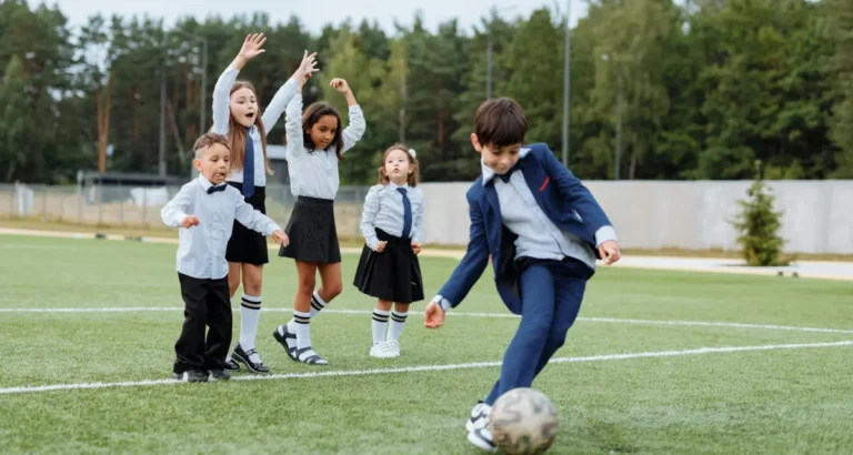 School kids playing soccer